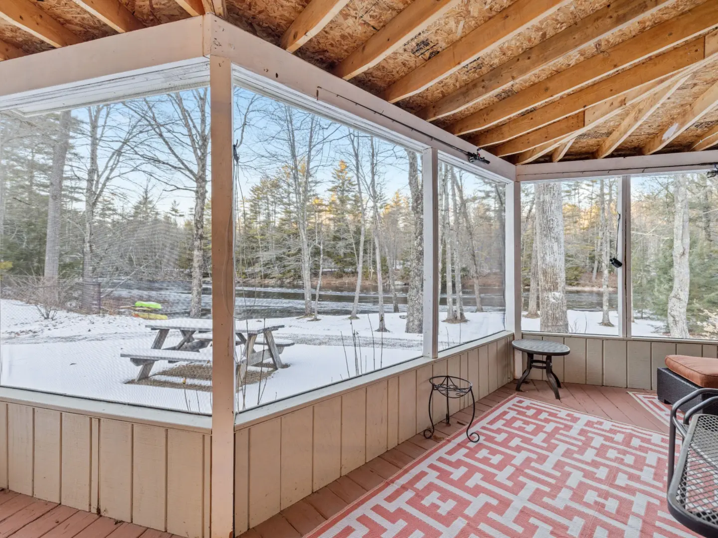 3-season-room-installation-on-the-snowy-landscape-of-a-forest-behind-the-windows-in-needham-ma