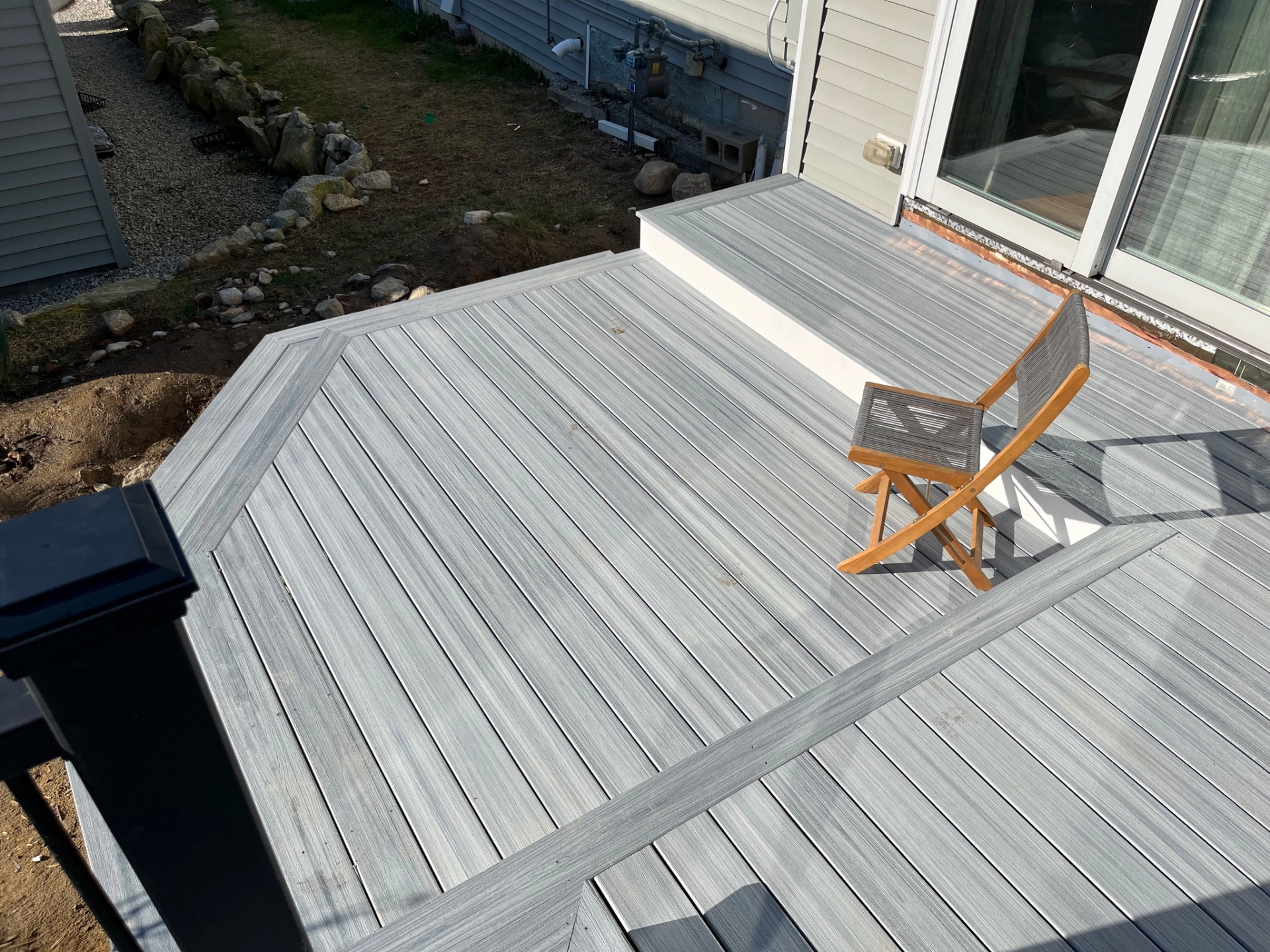 aerial-view-of-the-pvc-deck-installation-with-a-chair-in-needham-ma