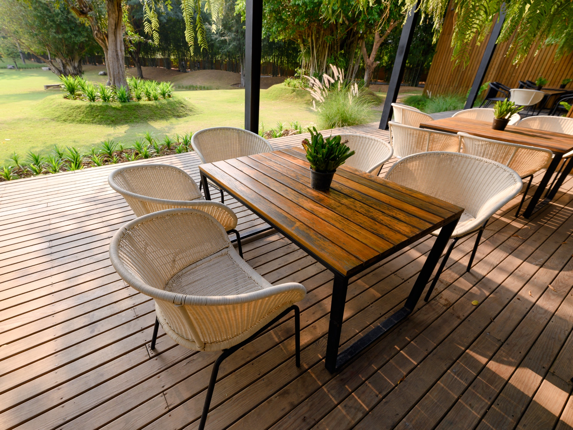 commercial-wooden-deck-and-chair-with-table-and-green-flora-in-needham-ma