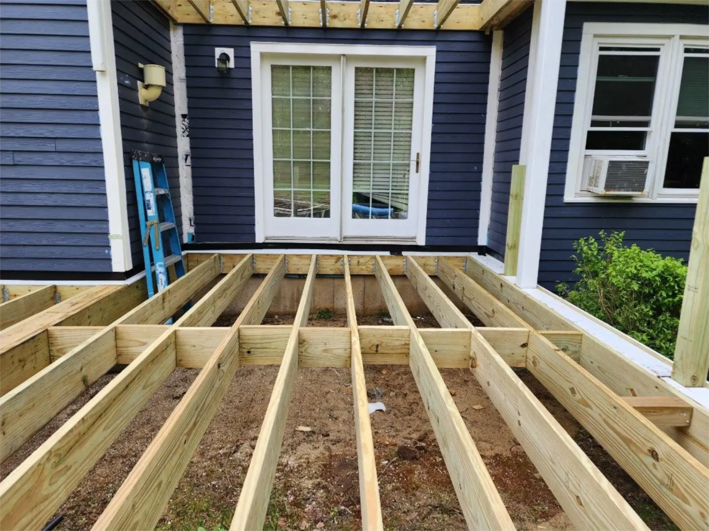 deck-framing-crafted-to-the-front-of-the-house-in-needham-ma