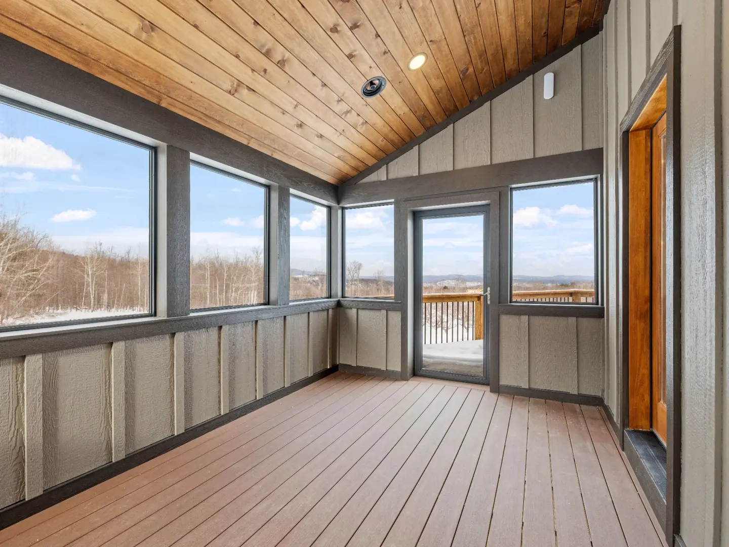 empty-balcony-with-doors-and-a-sliding-glass-door-with-overlooking-nature-view-in-needham-ma