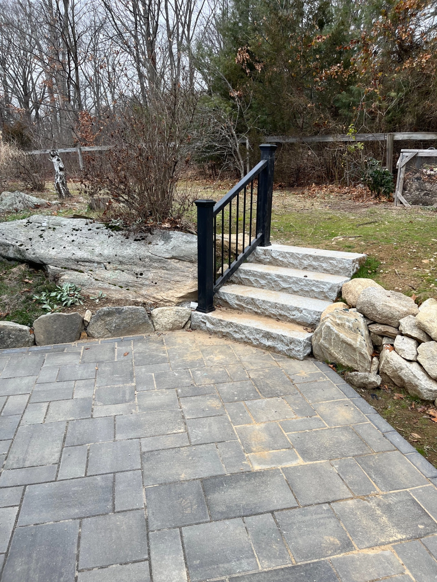 patio-with-black-metal-railing-in-needham-ma