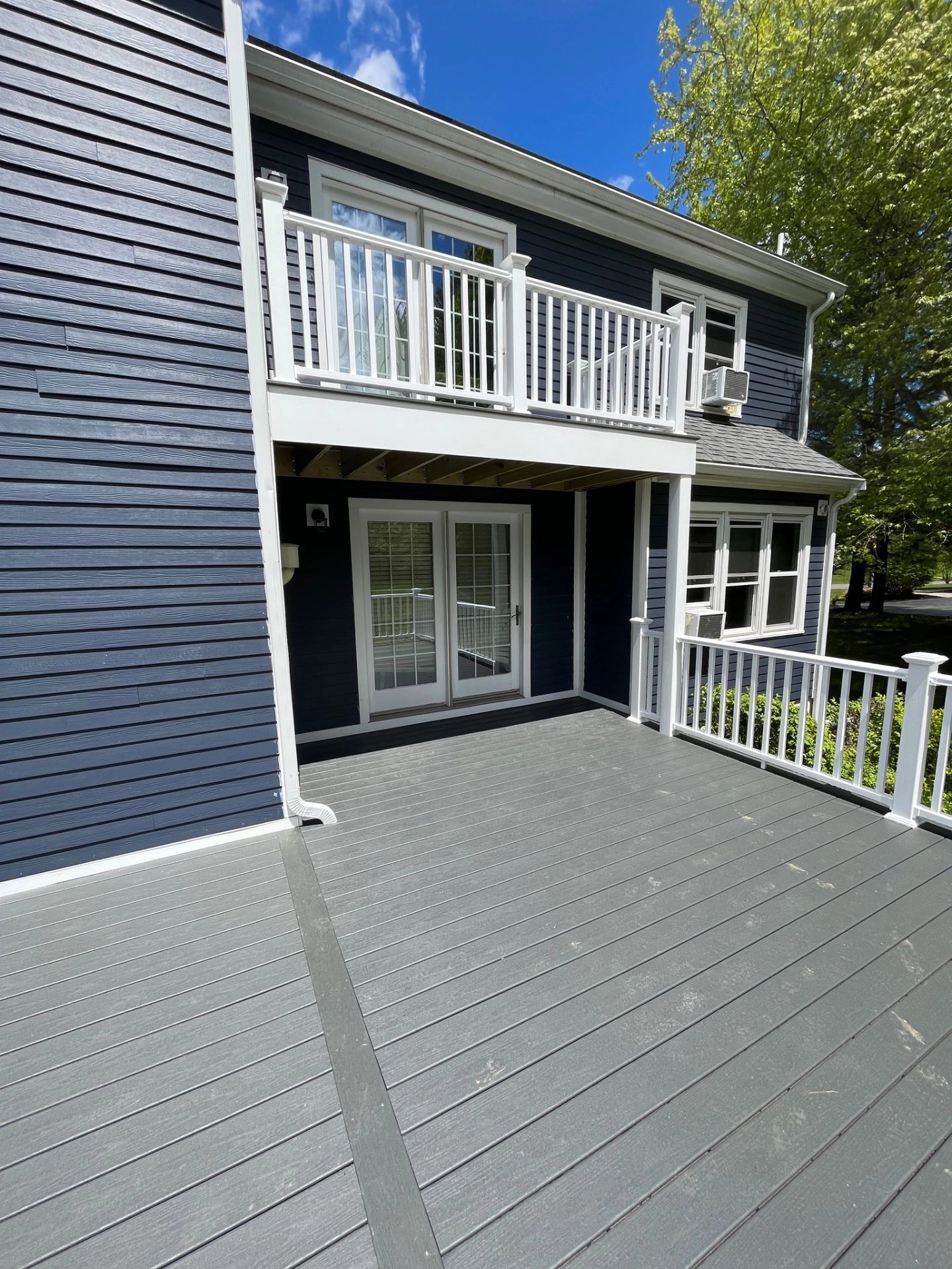 residential-deck-with-under-deck-and-white-deck-railing-in-needham-ma
