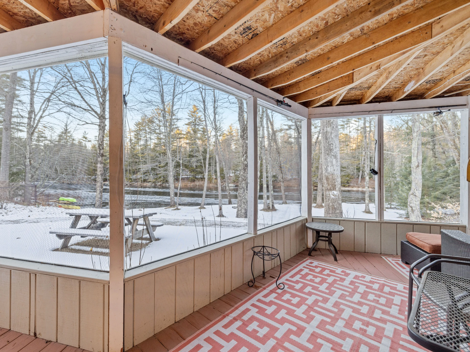 snowy-land-and-trees-landscape-view-from-screened-in-porch-in-needham-ma