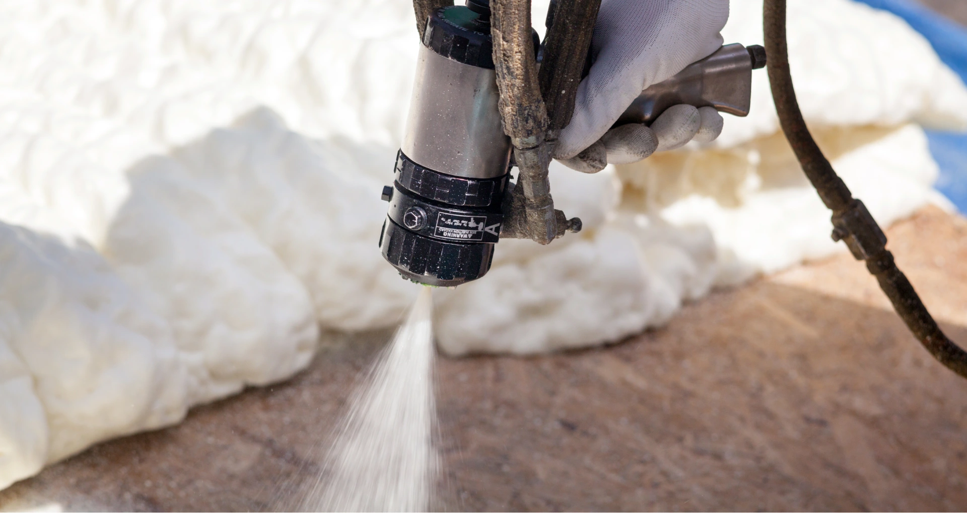 technician-spraying-foam-insulation-in-needham-ma