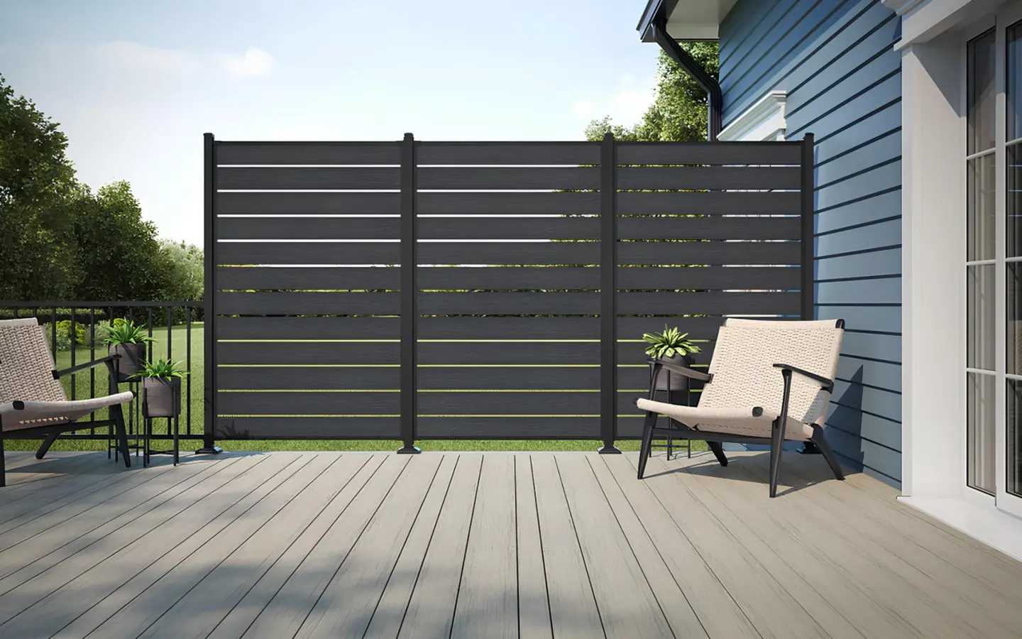 voyage-tundra-varied-width-dark-slate-privacy-screen-on-the-pvc-deck-with-couch-in-needham-ma