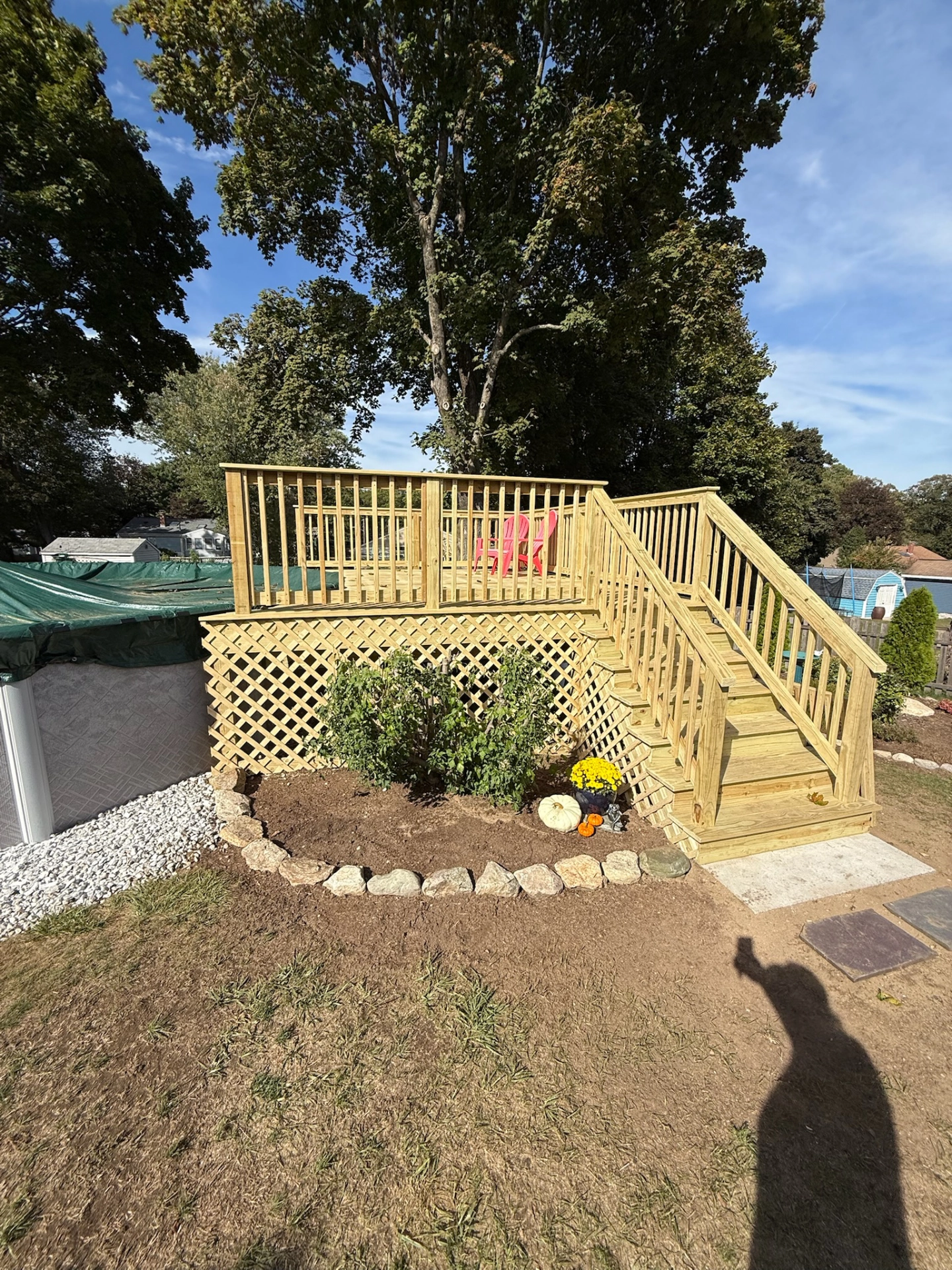 wooden-deck-and-railing-with-skirting-beside-the-covered-pool-in-needham-ma